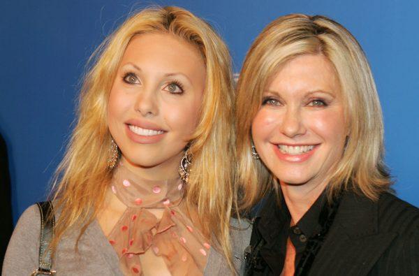 Singer Olivia Newton John (R) and her daughter Chloe Lattanzi arrive at Grammy Jams' celebration of Stevie Wonder at the Orpheum Theater in Los Angeles, Calif., on Dec. 10, 2005. (Kevin Winter/Getty Images)