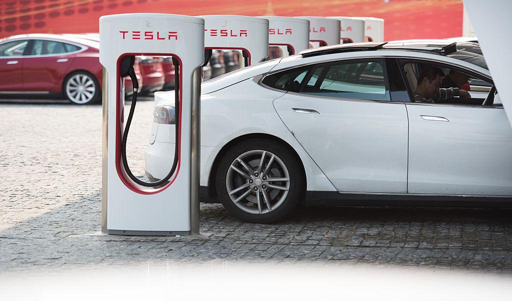 Tesla Model S is charging at a car dealership in Shanghai on March 17, 2015. (Johannes Eisele/AFP/Getty Images)