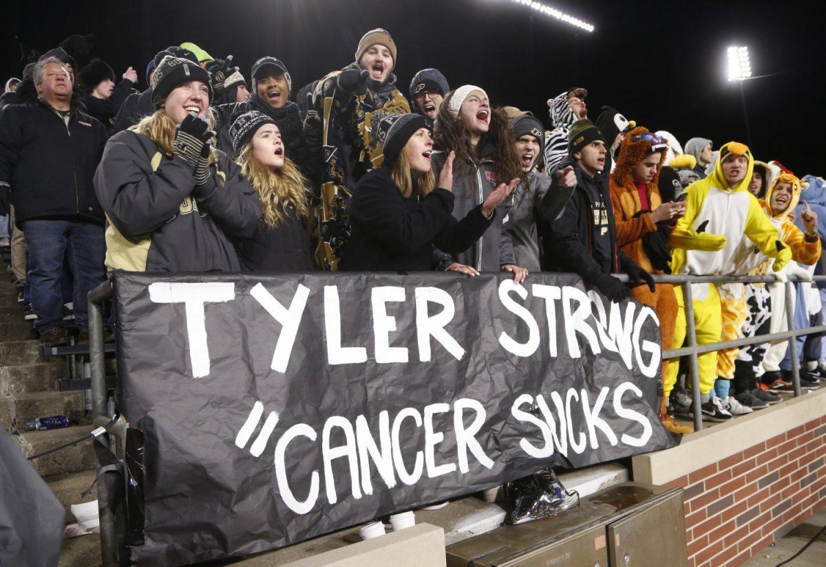 In this Oct. 20, 2018, photo, Purdue faithful show their support for Tyler Trent as Purdue pulls away from Ohio State in the fourth quarter of an NCAA college football game, at Ross-Ade Stadium in West Lafayette, Ind. (John Terhune/Journal & Courier via AP)