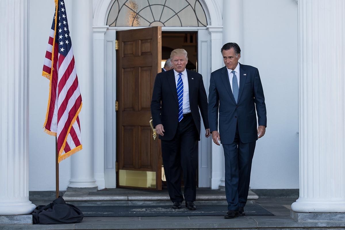 President-elect Donald Trump and Mitt Romney leave the clubhouse after their meeting at Trump International Golf Club in Bedminster Township, N.J., on Nov. 19, 2016. (Drew Angerer/Getty Images)