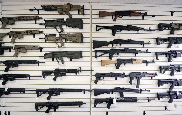 Semi-automatic rifles fill a wall at a gun shop in Lynnwood, Wash., on Oct 2, 2018. (Elaine Thompson/AP)