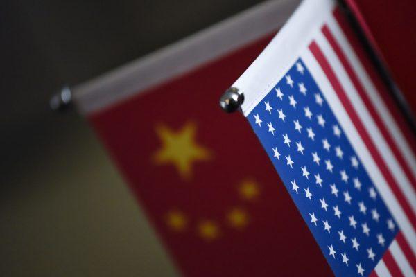 Chinese flags and American flags are displayed in a company in Beijing on Aug. 16, 2017. (Wang Zhao/AFP/Getty Images)