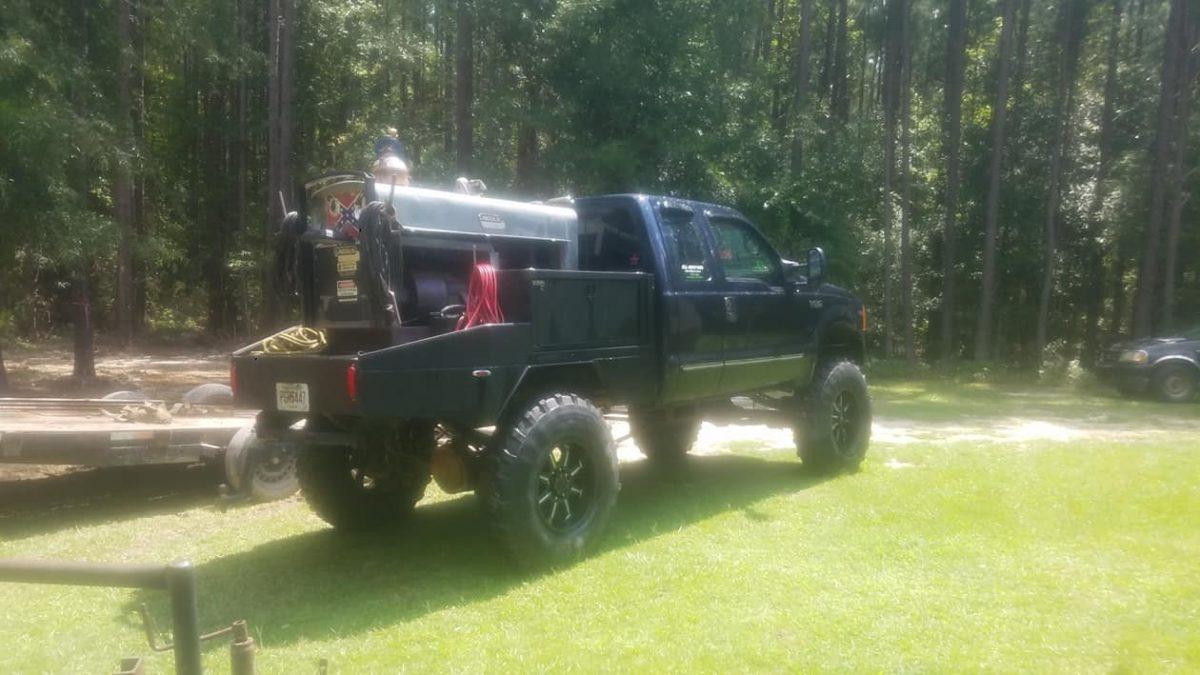 A modified 1999 Ford pickup truck belonging to Steven Rhodes was found deep in the woods on private property in Crawfordville, Georgia on Jan. 1, 2019. Two bodies found inside are believed to be Steven Rhodes and his wife Melissa Meeks Rhodes in what authorities were describing as a murder-suicide. (Greene County Georgia Sheriff's Office)