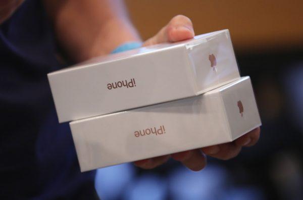 An Apple employee prepares Apple iPhone 7 phones on the first day of sales of the new phone at the Berlin Apple store in Berlin, Germany, on Sept. 16, 2016. (Sean Gallup/Getty Images)