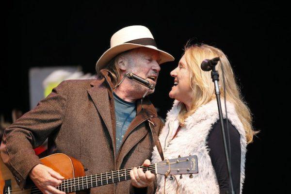 Neil Young, left, and his wife Pegi Young perform during the Bridge School Benefit concert in Mountain View, Calif. On Oct. 24, 2010. (AP Photo/Tony Avelar)