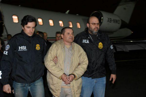 Mexico's top drug lord Joaquin "El Chapo" Guzman is escorted as he arrives at Long Island MacArthur airport in New York, U.S., Jan. 19, 2017, after his extradition from Mexico. (U.S. officials/Handout via Reuters/File Photo)
