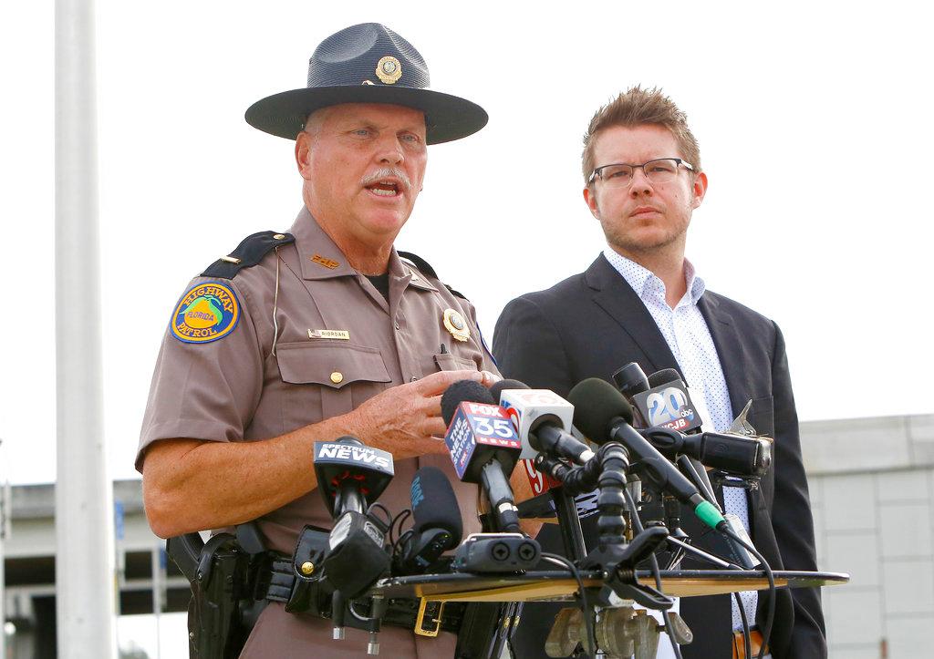 Florida Highway Patrol Lt. Pat Riordan, left, along with Troy Roberts, the spokesperson for the Florida Department of Transportation, updates members the media during a press conference, Friday, Jan. 4, 2019, in Gainesville, Fla., about a fiery highway crash the day before that killed at least seven people. (Brad McClenny/The Gainesville Sun/AP)