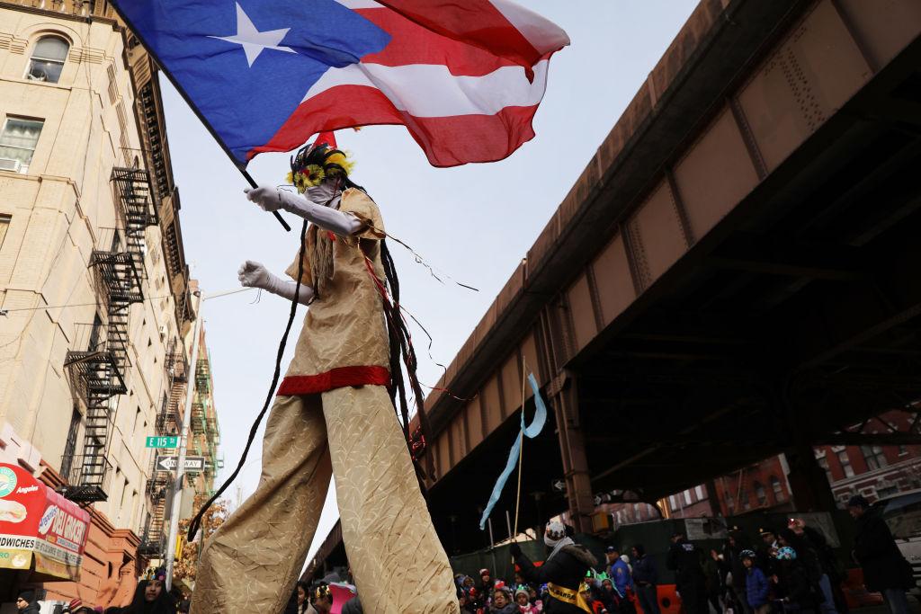 Stilt dancers wave their flags in the 42nd annual Three Kings Day Parade in New York, on Jan. 4, 2019. (Spencer Platt/Getty Images)