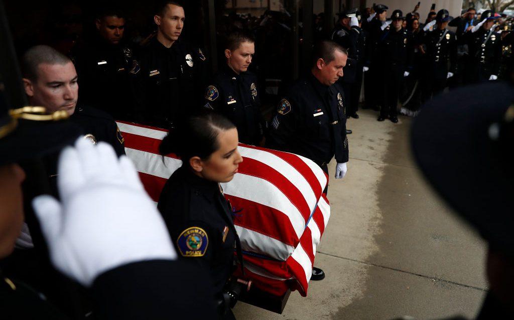 Officers with the Newman Police Department carry the flag-draped casket of slain officer Corporal Ronil Singh during a funeral service at CrossPoint Community Church in Modesto, Calif., on Jan. 5, 2019. (Stephen Lam/Getty Images)