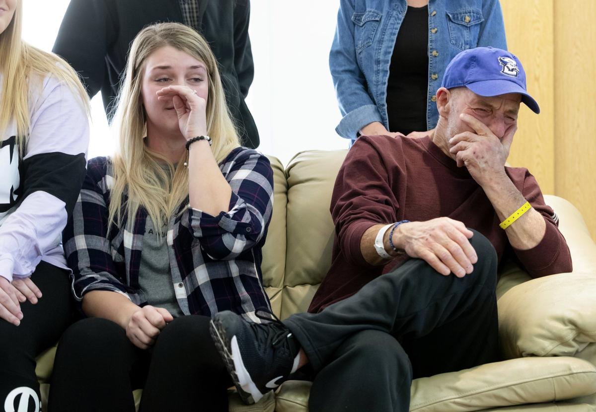 In this Thursday, Jan. 3, 2019 photo, T. Scott Marr and his daughter, Preston Marr, left, break down during a press conference in Omaha, Neb. Thought to be brain dead, T. Scott Marr awakened after being taken off life support. (Kent Sievers/Omaha World-Herald/AP)