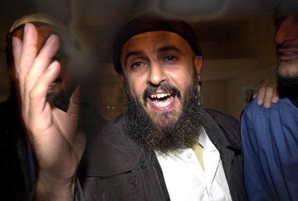 Jamal al-Badawi, a suspect of the USS Cole destroyer's bombing in 2000 in the Yemeni port of Aden, gestures after an appeal court announced his judgment to 15 years in prison in the final appeal session trial, 26 Feb. 2005. (Khaled Fazaa/AFP/Getty Images)