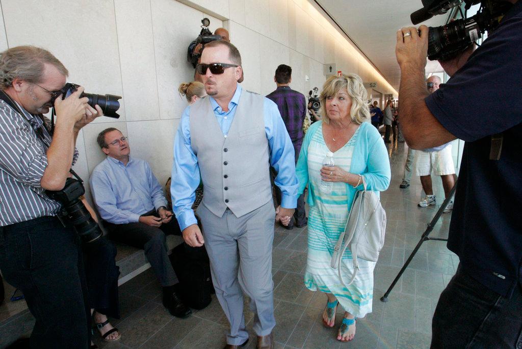 Michael McStay, brother of the victims, and Susan Blake, their mother, arrive at court for the preliminary hearing for accused killer Chase Merritt in San Bernardino, Calif. Opening statements are expected Monday, Jan. 7, 2018. (John Gibbins/The San Diego Union-Tribune/AP)