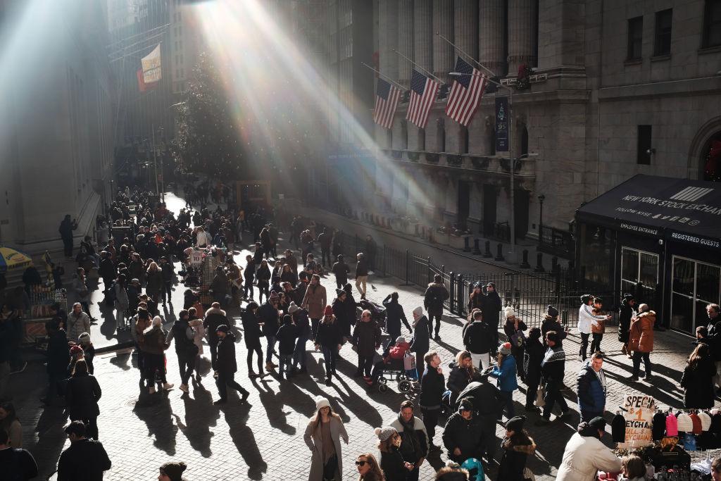 People congregate outside of the New York Stock Exchange (NYSE) in lower Manhattan during the holiday week between Christmas and the New Year on December 29, 2018 in New York City. Despite the government shutdown, the Statue of Liberty and the Museum of the American Indian, two major tourists destinations, have so far remained open. (Spencer Platt/Getty Images)