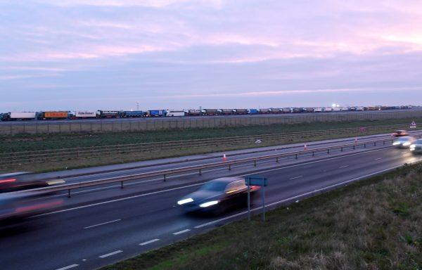 Trucks are seen in line at Manston Airport waiting to do a test drive to the Port of Dover during a trial of how roads will cope in case of a "no-deal" Brexit, in Kent, United Kingdom, on Jan. 7, 2019. (Reuters/Toby Melville)