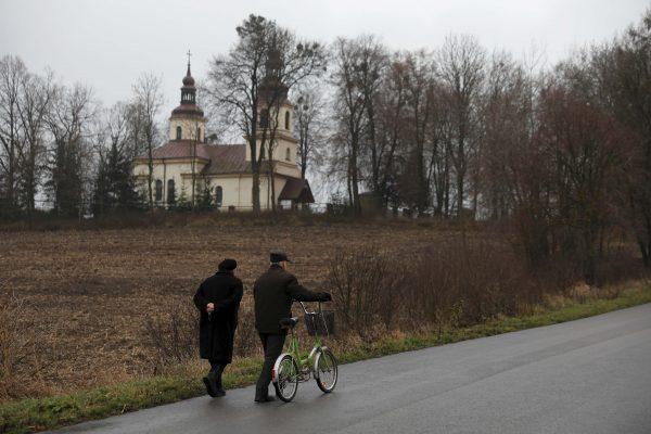 People go to a mass in Kalinowka, Poland, on Nov. 25, 2018. (Reuters/Kacper Pempel)
