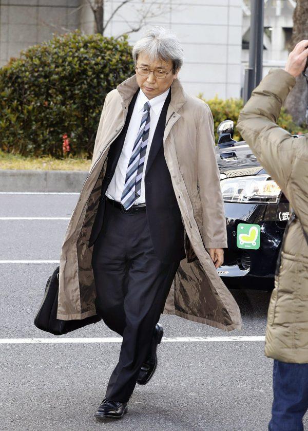 Motonari Otsuru, left, chief lawyer of the legal team for former Nissan chairman Carlos Ghosn, arrives at Tokyo District Court for a court hearing on a case of Ghosn in Tokyo on Jan. 8, 2019. (Shinji Kita/Kyodo News via AP)