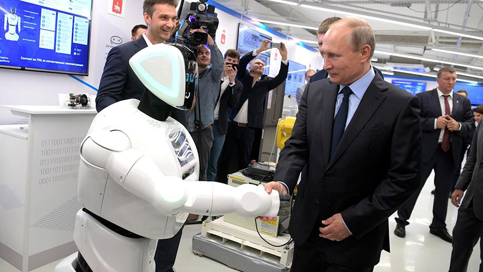 An undated photo shows a Promobot shaking Russian leader Vladimir Putin's hand. (Kremlin government photo)