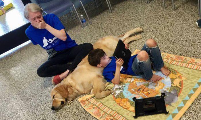 Crying Mom Silently Watches Her Son With Autism Cuddling a Service Dog