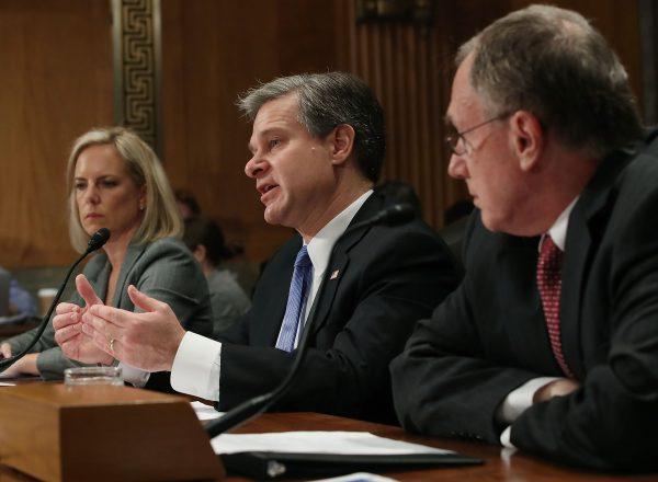 L-R: Homeland Security Secretary Kirstjen Nielsen, FBI Director Christopher Wray, and Russell Travers, acting director of the Office of the Director of National Intelligence National Counterterrorism Center, testify at a Senate hearing in Washington on Oct. 10, 2018. (Mark Wilson/Getty Images)