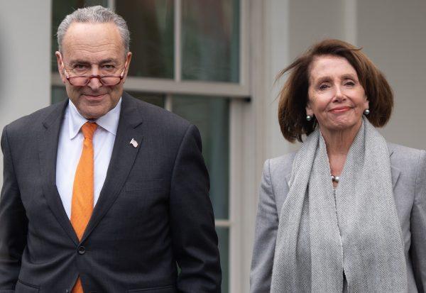 Senate Democratic Leader Chuck Schumer (D-N.Y.) and Speaker of the House Rep. Nancy Pelosi (D-Calif.) arrive to speak to the media following a meeting with President Donald Trump about the partial government shutdown at the White House in Washington on Jan. 9, 2019. (SAUL LOEB / AFP) (Photo credit should read SAUL LOEB/AFP/Getty Images)