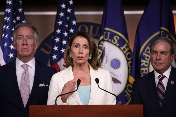 Rep. Richard Neal (D-Mass.) and Rep. John Yarmuth (D-Ky.), listen as Democratic Leader Nancy Pelosi (D-Calif.) speaks during her weekly press conference in the Capitol building in Washington, on July 20, 2017. (Joe Raedle/Getty Images)
