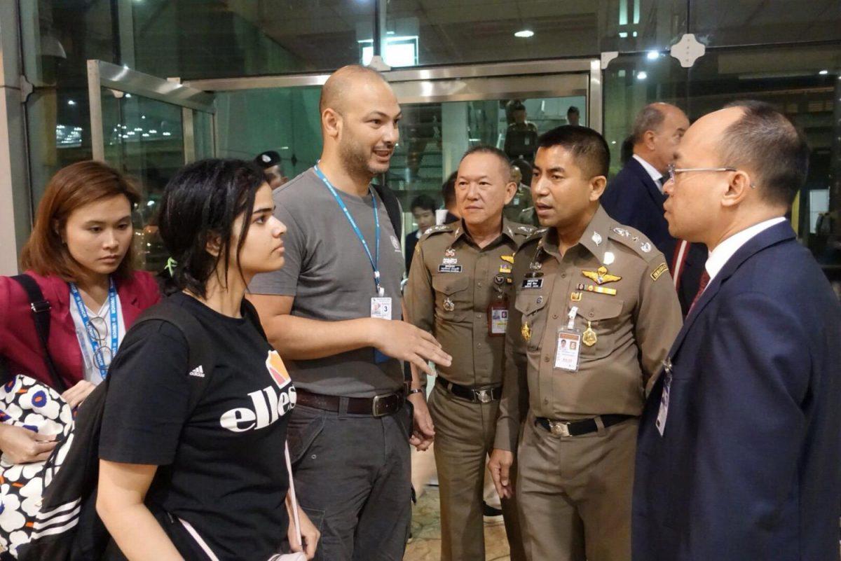 Saudi teen Rahaf Mohammed Alqunun is seen with Thai immigration authorities at a hotel inside Suvarnabhumi Airport in Bangkok, Thailand, on Jan. 7, 2019. (Thailand Immigration Police via Reuters)