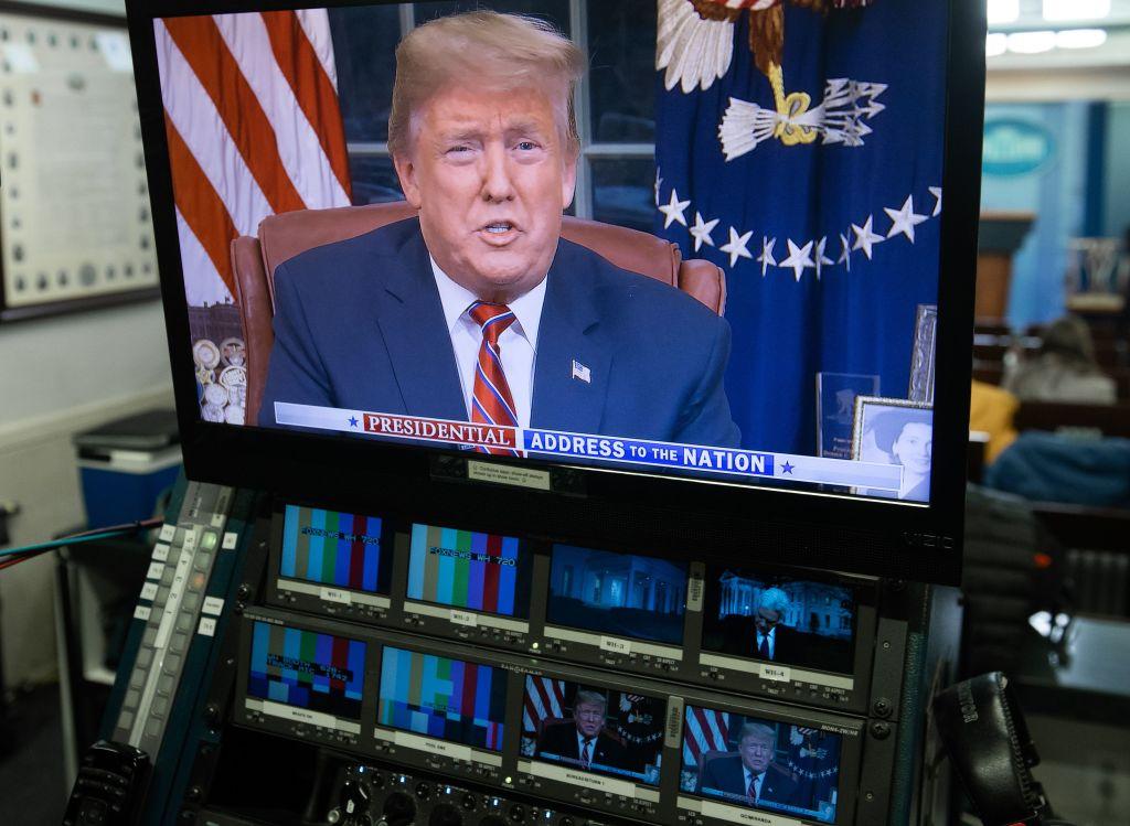 President Donald Trump appears on a television screen in the Press Briefing Room of the White House in Washington, DC, on Jan. 8, 2019. (Saul Loeb/AFP/Getty Images)