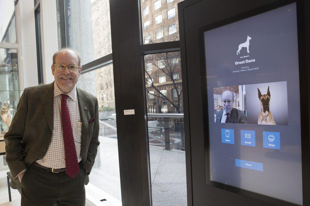 American Kennel Club Museum of the Dog's Executive Director Alan Fausel smiling after finding his dog breed match at the Find Your Match interactive kiosk during a tour of the museum in N.Y., on Jan. 9, 2019. The museum opens Feb. 8. (Mary Altaffer/AP)