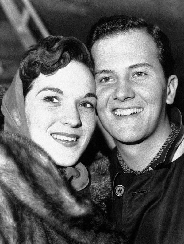 American singer Pat Boone and his wife Shirley are pictured at the London airport after their arrival from N.Y., on April 4, 1958. (Wade Payne/Invision/AP)