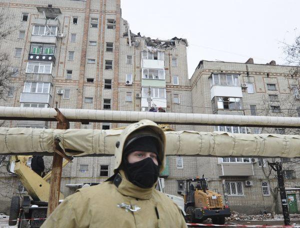 An Emergency services worker at the scene of the destroyed top floor of a apartment building in the city of Shakhty, Russia, on Jan. 14, 2019. (Photo/AP)