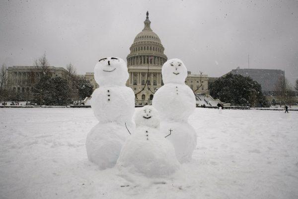 A snow family is seen on Capitol Hill in Washington as a winter storm arrives on Jan. 13, 2019. (AP Photo/Alex Brandon)