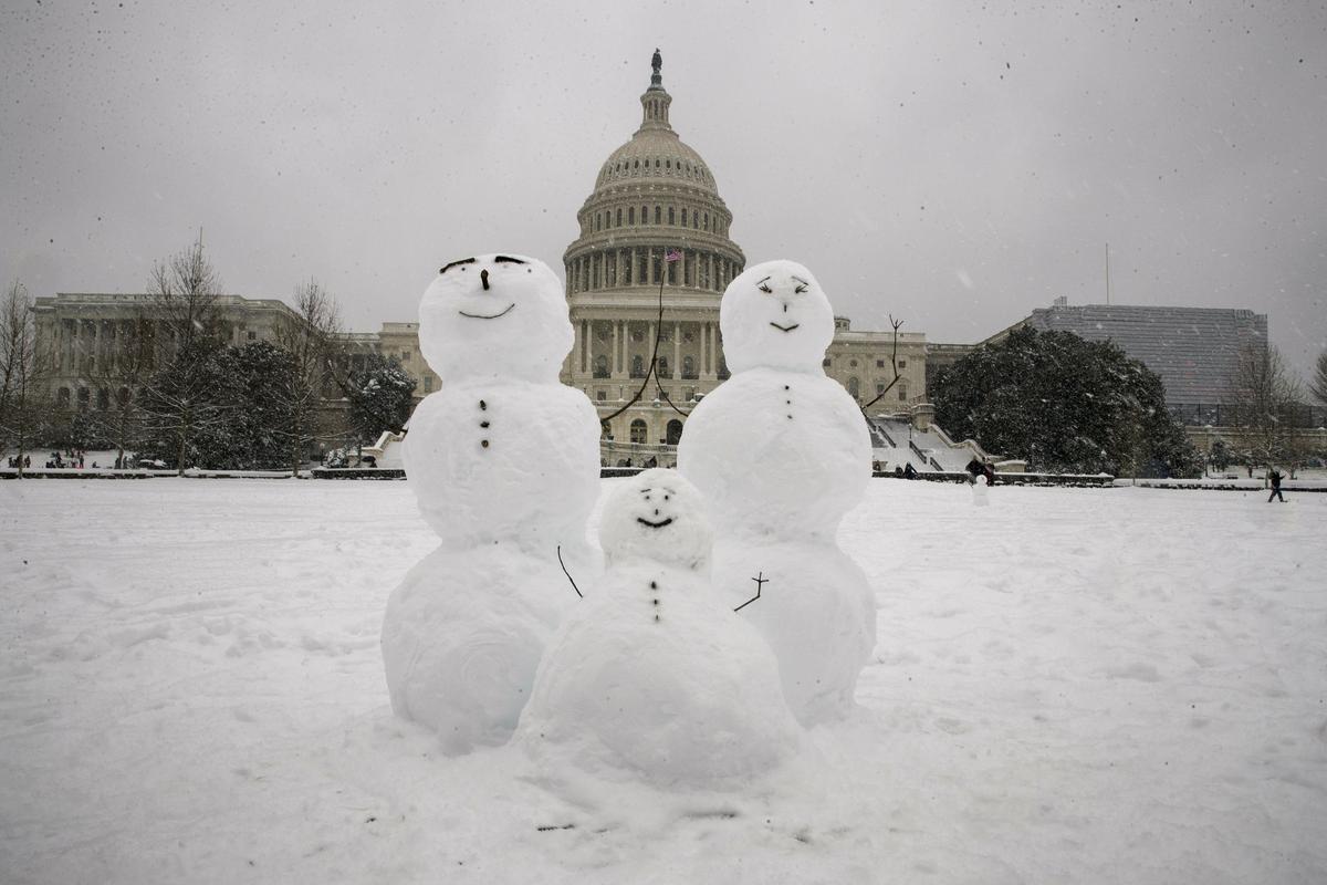 A snow family is seen on Capitol Hill as a winter storm arrives in the region, Sunday, Jan. 13, 2019, in Washington. (AP Photo/Alex Brandon)