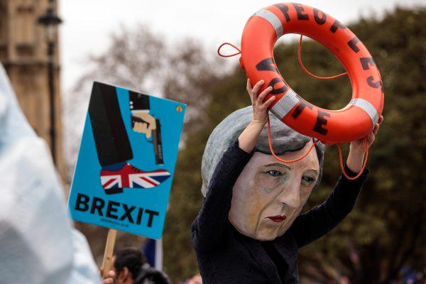 A demonstration featuring a papier-mache Theresa May head is staged outside the Houses of Parliament in London on Jan. 15, 2019 (Jack Taylor/Getty Images)