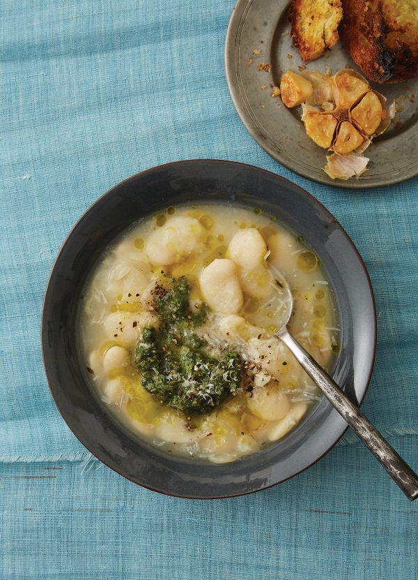 Parmesan rinds can punch up a soup, like these Brothy Beans With Roasted Garlic. (Penny De Los Santos)