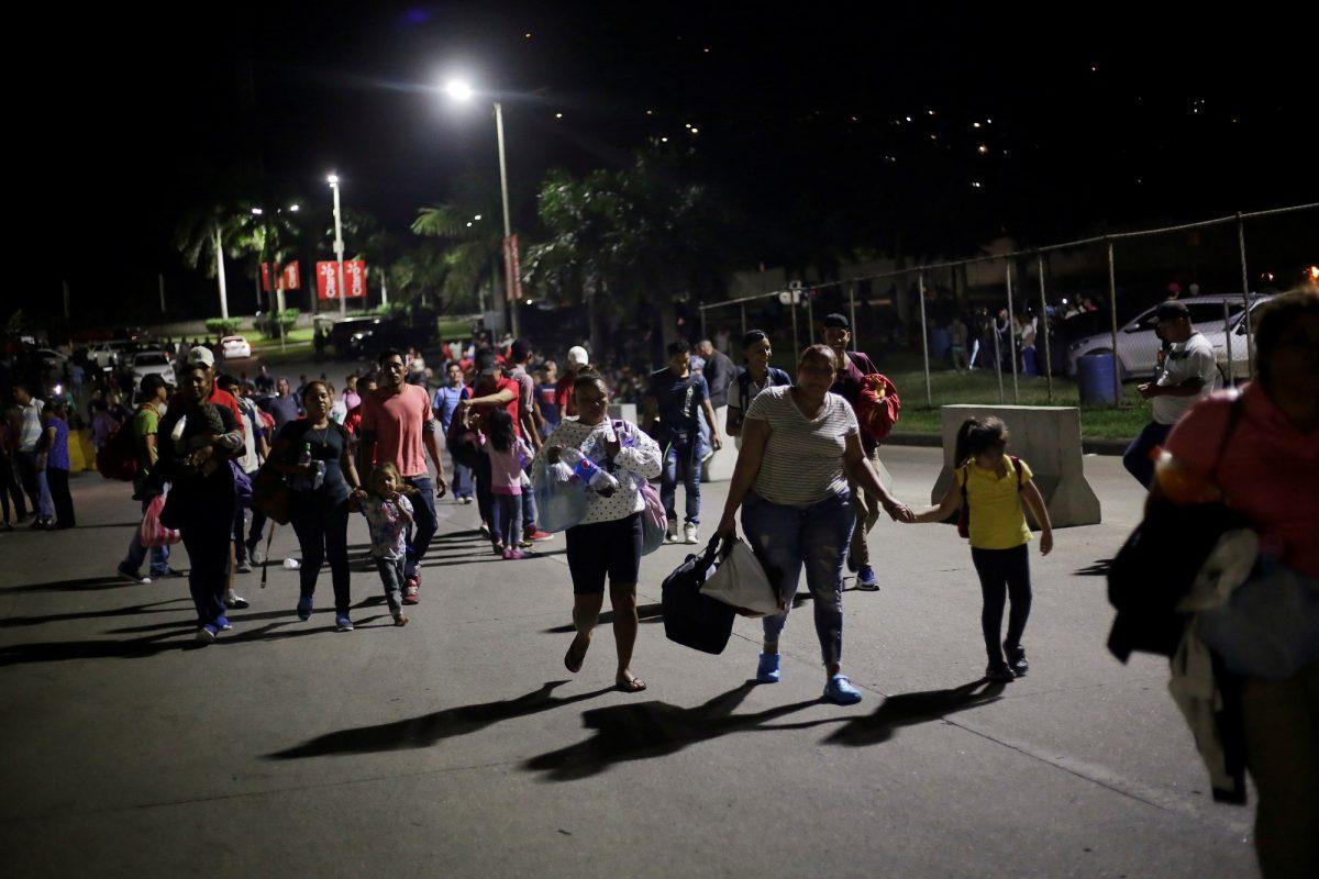 Hondurans take part in a new caravan of migrants, set to head to the United States, as they leave San Pedro Sula on Jan. 14, 2019. (Jorge Cabrera/Reuters)