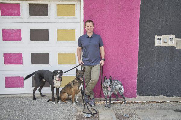 Jeffrey Franklin with three of his dogs. Franklin trains canines for individuals, military, and police. (Courtesy of Joelle Speranza)