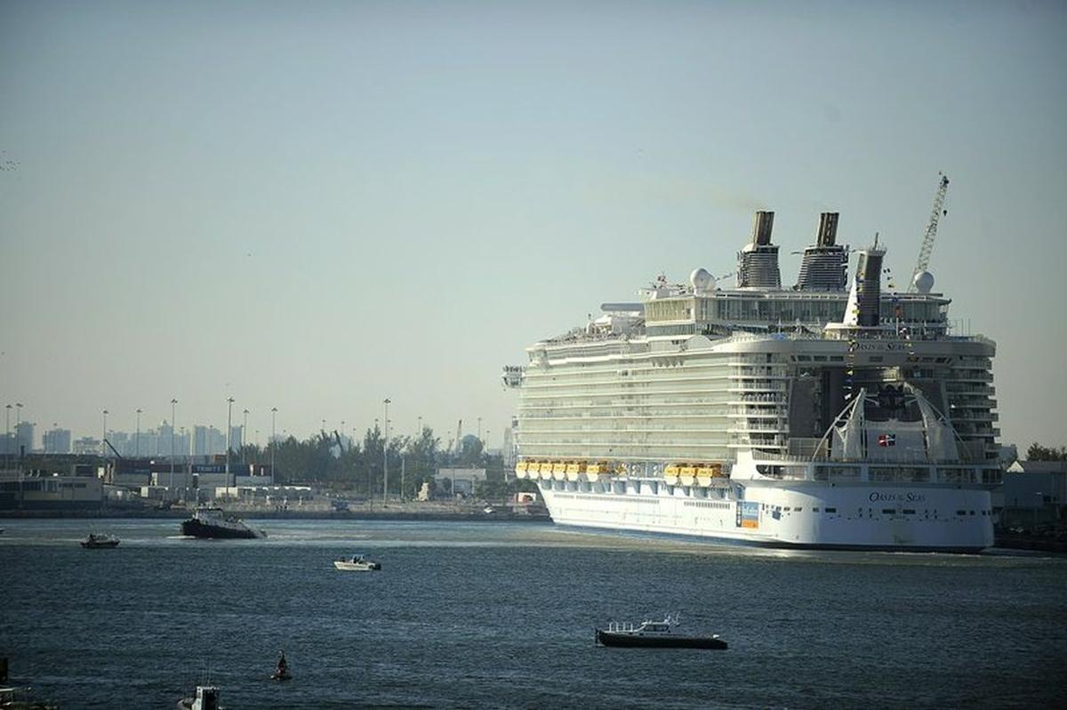 Royal Caribbean's Oasis of the Seas cruise ship is docked at Port Everglades in Fort Lauderdale, Fla. The ship is returning to a Florida port a day early and giving passengers full refunds of their fare after 277 guests and crew members were hit with an outbreak of Norovirus as it sailed to Jamaica. The ship was expected to arrive in Port Canaveral on Jan. 12. (Josh Ritchie/South Florida Sun-Sentinel via AP, File)