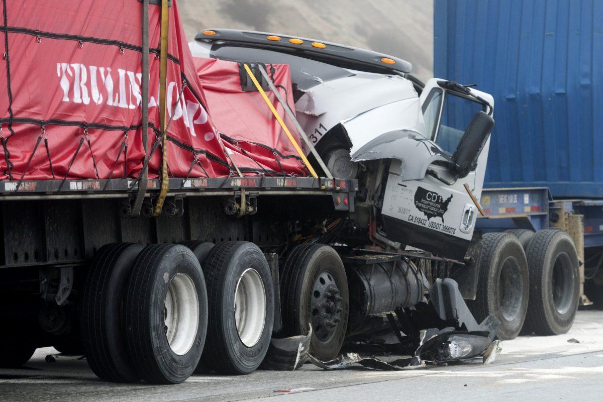 Damaged trucks remain on Interstate 15 after a multi-car collision in the Cajon Pass near Hesperia, Calif., on Jan. 16, 2019. (James Quigg/The Daily Press/AP)