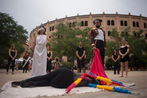 Animal rights activists protest by re-enacting a bullfight during the Corpus bullfighting festival outside Granada Bullring on June 15, 2017. (Jorge Guerrero/AFP/Getty Images)
