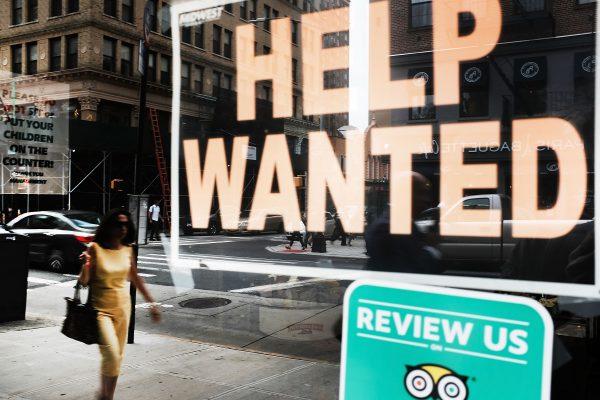 A help wanted sign is displayed in the window of a Brooklyn business in New York on Oct. 5, 2018. (Spencer Platt/Getty Images)