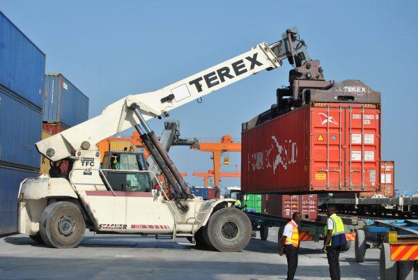 A crane picks up a container from a train and loads it onto a tractor at the Port of Mombasa, on Jan. 15, 2019. (Dominic Kirui/Special to The Epoch Times)