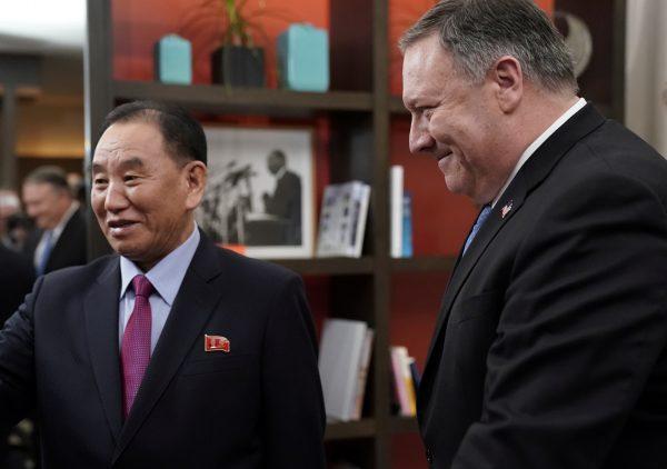 Secretary of State Mike Pompeo escorts Vice Chairman of the North Korean Workers' Party Committee Kim Yong Chol, North Korea's lead negotiator in nuclear diplomacy with the United States, into talks aimed at clearing the way for a second U.S.-North Korea summit as they meet at a hotel in Washington on Jan. 18, 2019. (Joshua Roberts/Reuter)