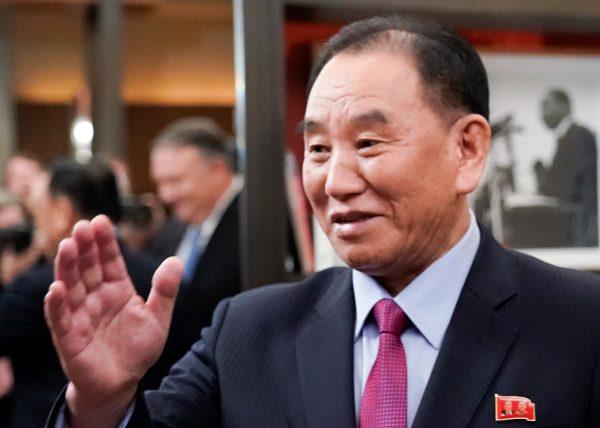 Vice Chairman of the North Korean Workers' Party Committee Kim Yong Chol, North Korea's lead negotiator in nuclear diplomacy with the United States, waves as he meets with U.S. Secretary of State Mike Pompeo (reflected in background 2ndL) for talks aimed at clearing the way for a second U.S.-North Korea summit in Washington, on Jan. 18, 2019. (Joshua Roberts/Reuters)