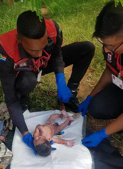 Medics tend to the new-born baby boy who survived uninjured after being abandoned in Verulam, South Africa on Jan. 14, 2018. (Response Unit South Africa)