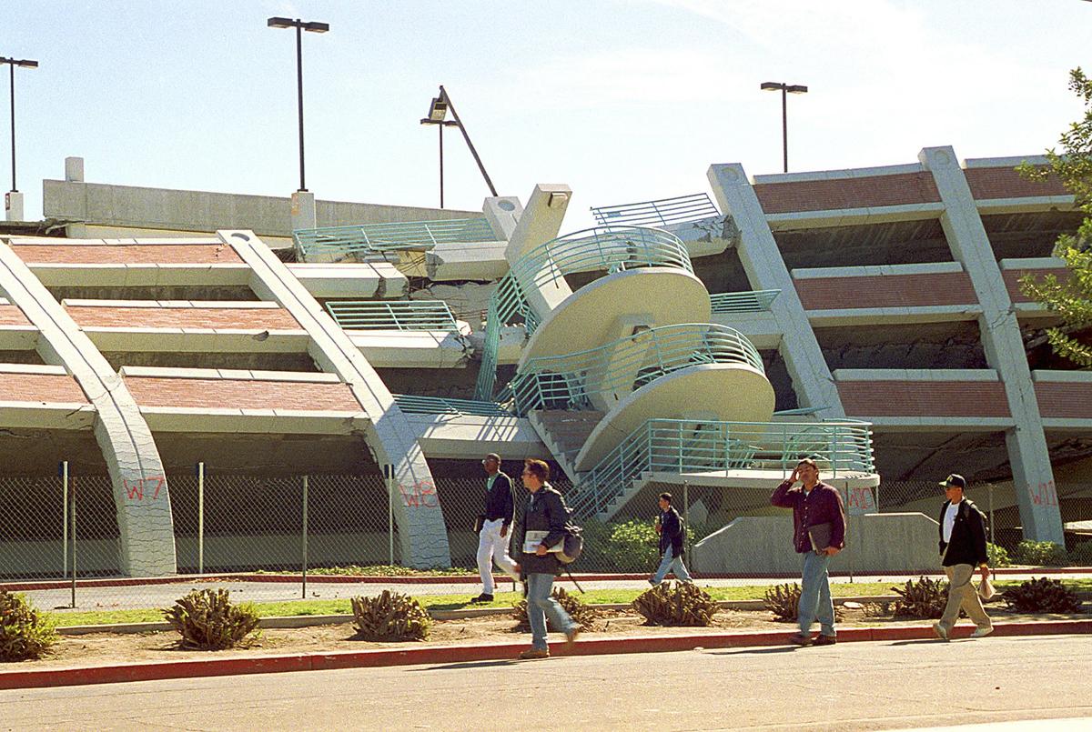 This Feb. 14, 1994 file photo shows California State University, Northridge students walking past a parking structure at the Los Angeles campus that collapsed in the Jan. 17 earthquake.(AP Photo/Mark J. Terrill)