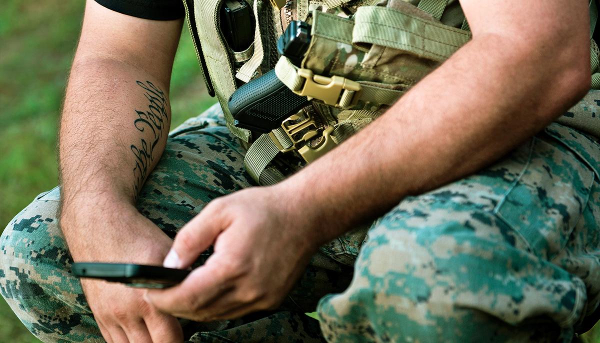 US Soldier Photographed Watching His Child’s Birth on Phone During Flight Delay