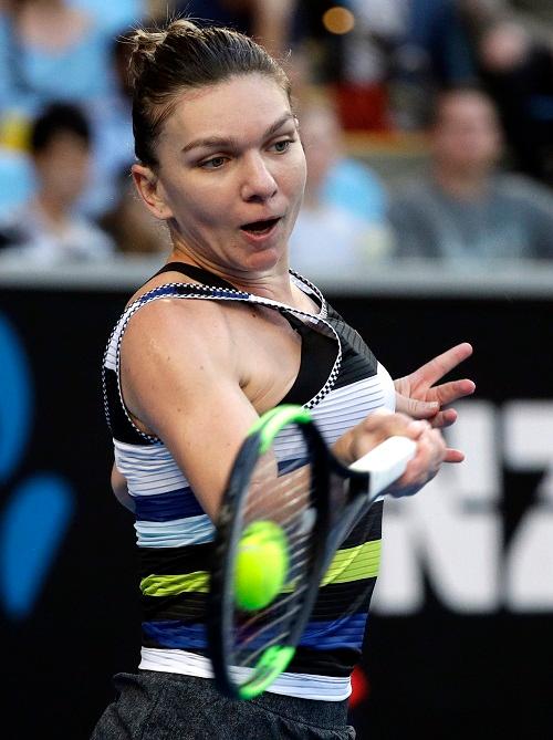 Romania's Simona Halep makes a forehand return to United States' Venus Williams during their third round match at the Australian Open tennis championships in Melbourne, Australia, on Jan. 19, 2019. (Kin Cheung/AP Photo)