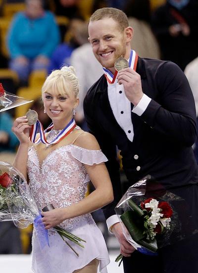 Bronze medalists Caydee Denney and John Coughlin, of the United States, smile during an award ceremony at the U.S. Figure Skating Championships in Boston, on Jan. 11, 2014, (Steven Senne/AP Photo)