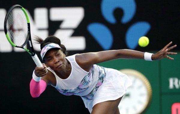 United States' Venus Williams makes a forehand return to Romania's Simona Halep during their third round match at the Australian Open tennis championships in Melbourne, Australia, on Jan. 19, 2019. (Kin Cheung/AP Photo)