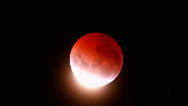 A blood red moon lights up the sky during a total lunar eclipse on April 4, 2015 in Auckland, New Zealand. (Phil Walter/Getty Images)